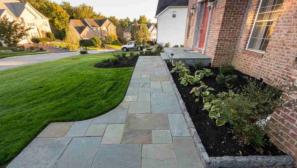 bluestone walkway Inetgration of lawn, hardscape and native plantings in Southern Maine